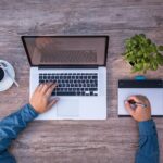 birdeye view of person sitting in front of a laptop